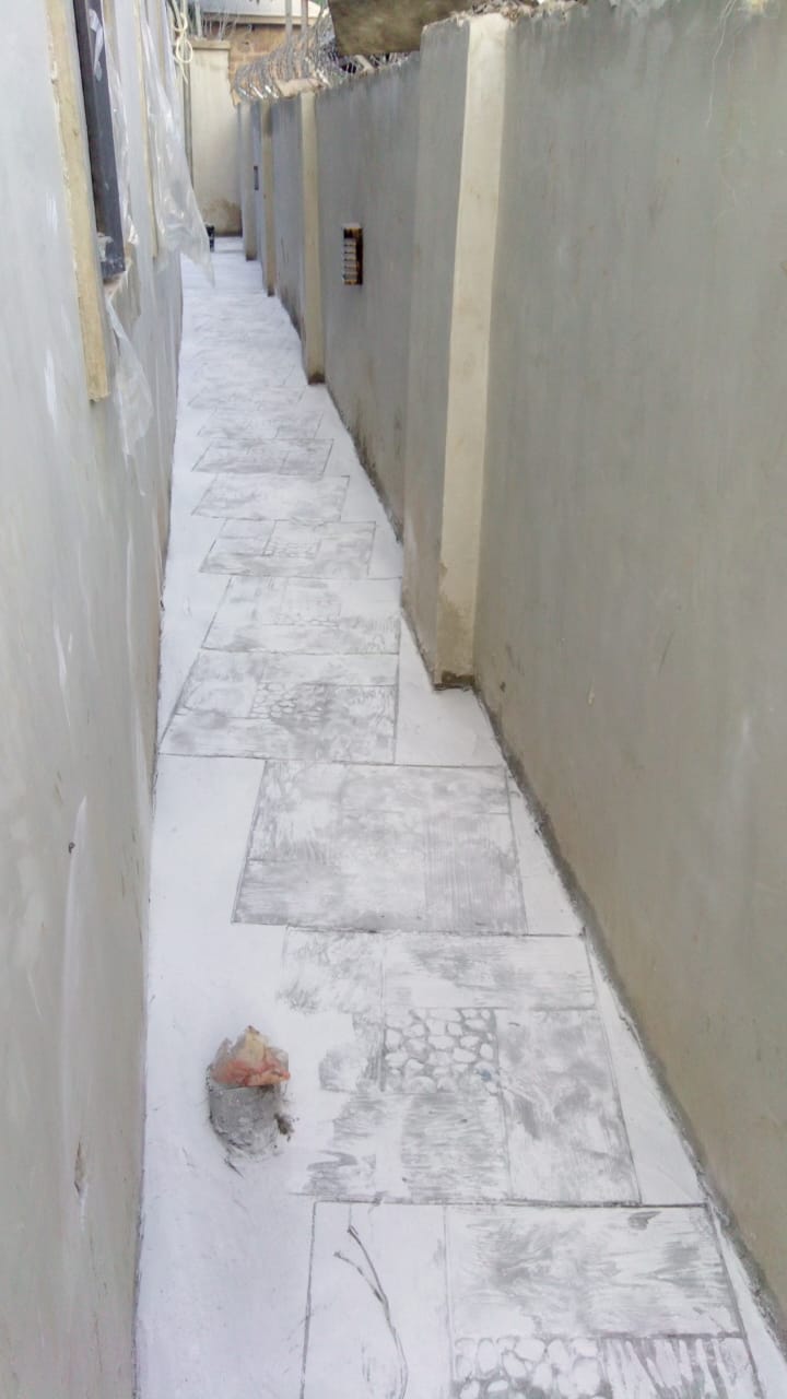 Side walkway stamped flooring and razor wire security installation