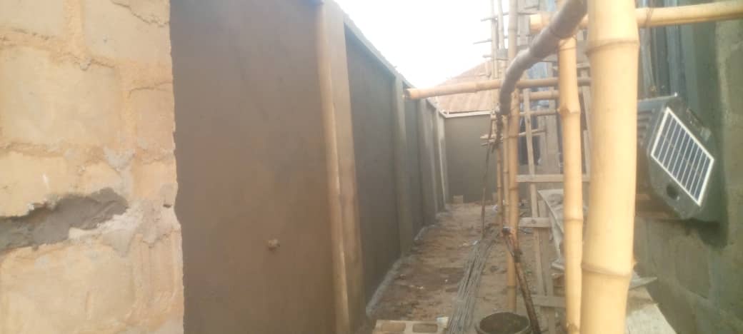 Perimeter wall plastering and site preparation in progress